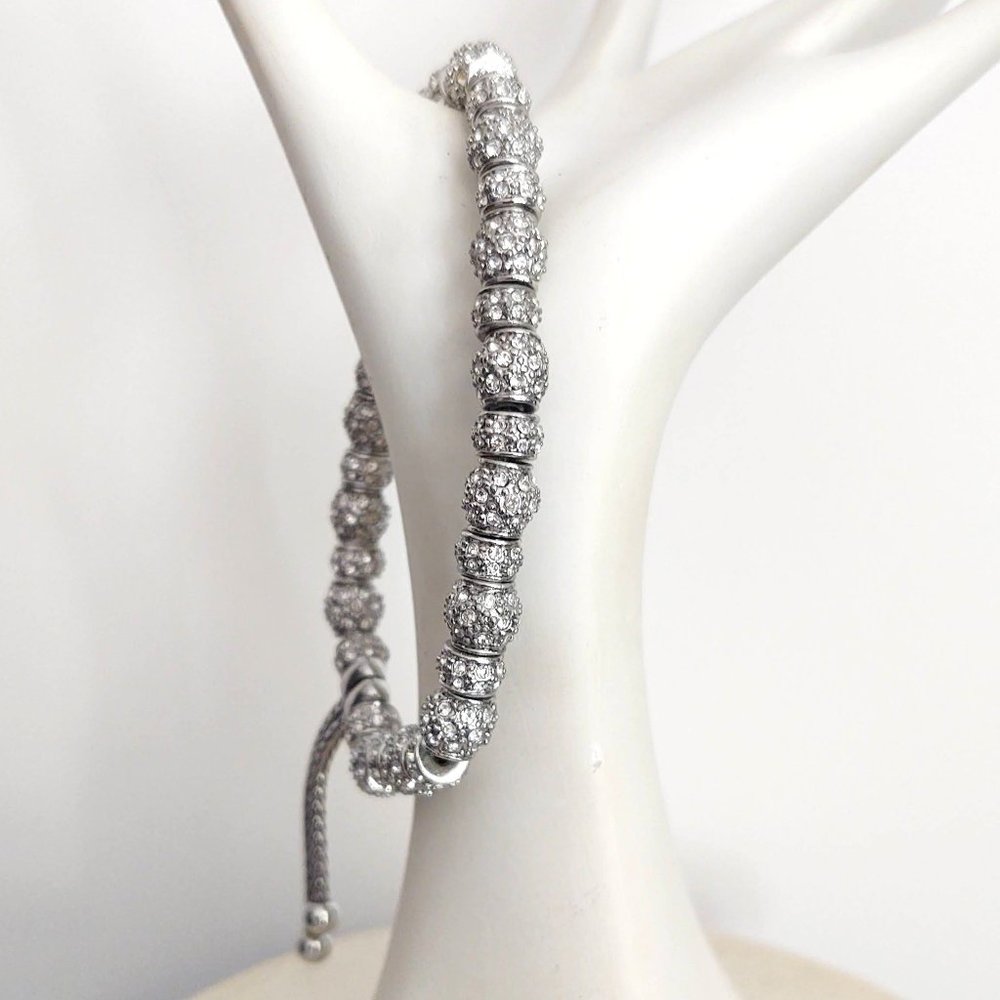 Faux bolero silver and crystal beaded stretch bracelet with silver tails